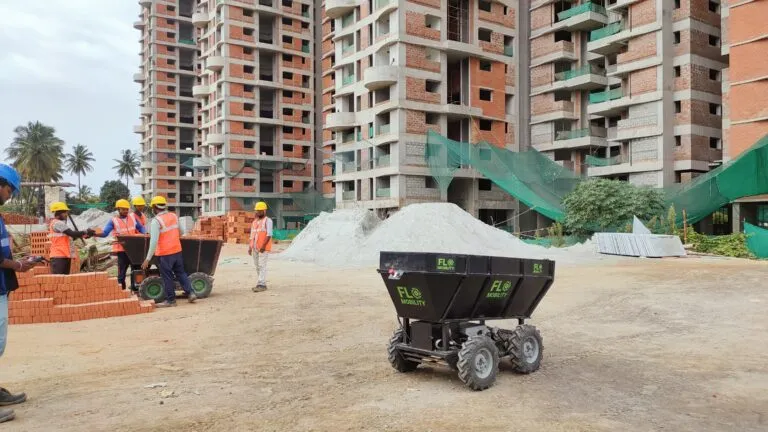 The Flo material mover, a four-wheeled electric dumper, on a construction site